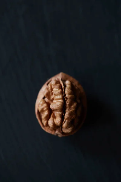 Walnut kernel on a slate backdrop — Stock Photo, Image