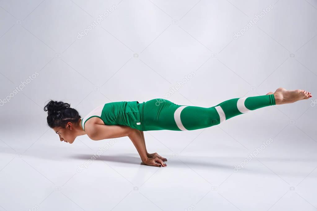 Woman doing yoga isolated on white background