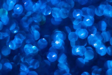 Bokeh ışıkları olan altın parıltılı şenlik arka planı. Yeni yıl, Noel tatilleri ve yıldönümleri için kutlama konsepti.