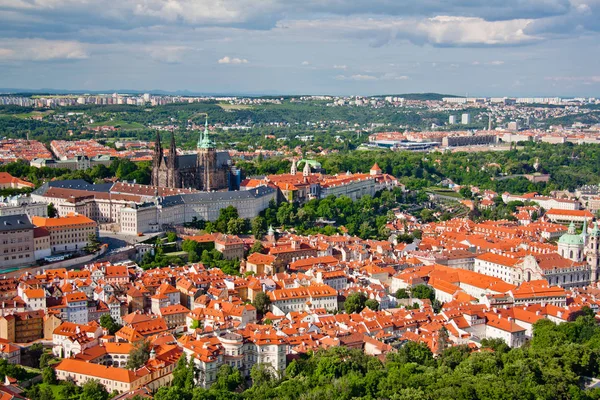 Aerial view of the city. St. Vitus Cathedral over old town red roofs. Prague, Czech Republic — Stock Photo, Image