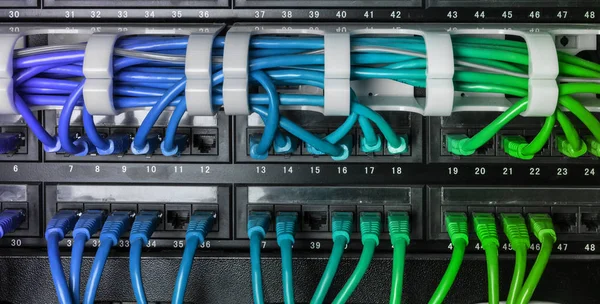 Server rack with blue internet patch cord cables — Stock Photo, Image