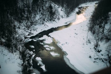 mountain stream in the winter clipart