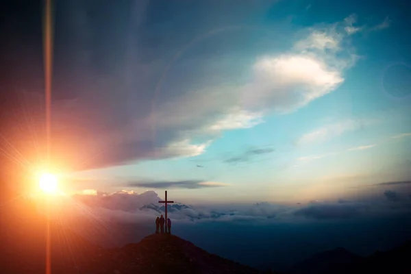 Resurrection of Jesus Christ concept: God Lamb in front of the cross of Jesus Christ on sunrise background