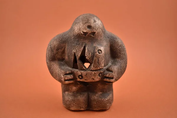 Prague golem statuette on a brown background stock photo images. Mystical Jewish creature. Prague golem clay statuette stock photo