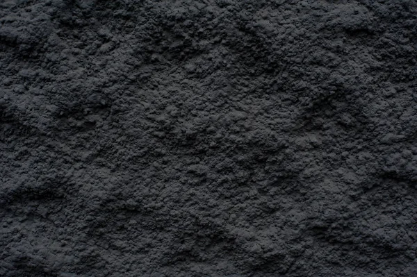 Текстура черной тисненой выпуклой стены — стоковое фото