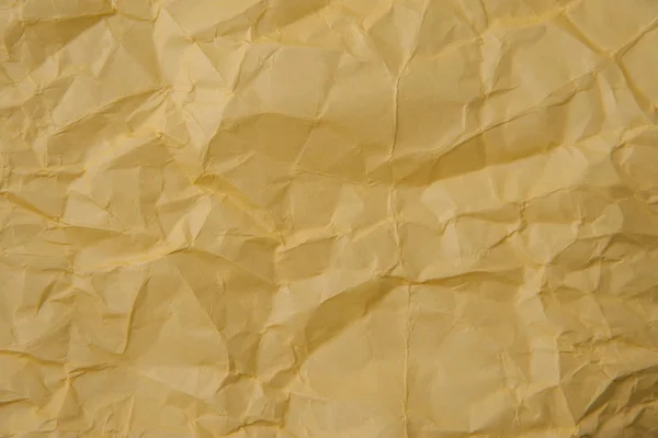Текстура желтой скомканной бумаги — стоковое фото
