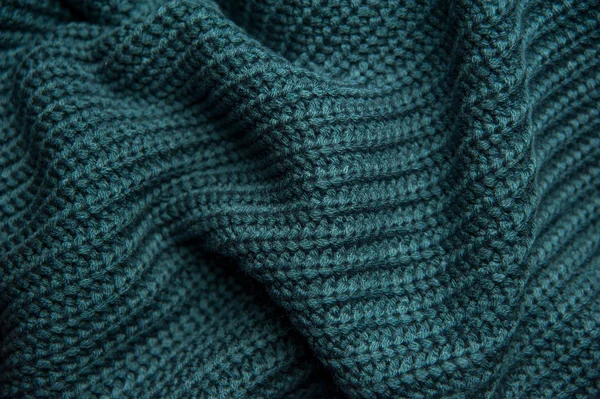 Υφή μάλλινου πλεκτού πράσινου-μπλε πουλόβερ. Τυρκουάζ ύφασμα — Φωτογραφία Αρχείου