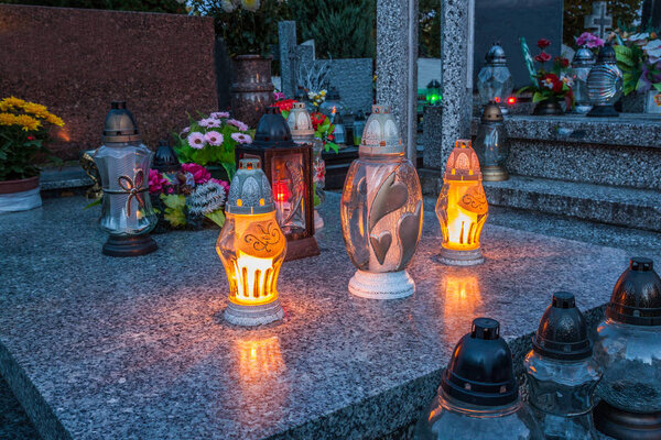 Candles Burning At a Cemetery 