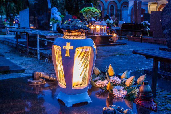 Candles Burning At a Cemetery 