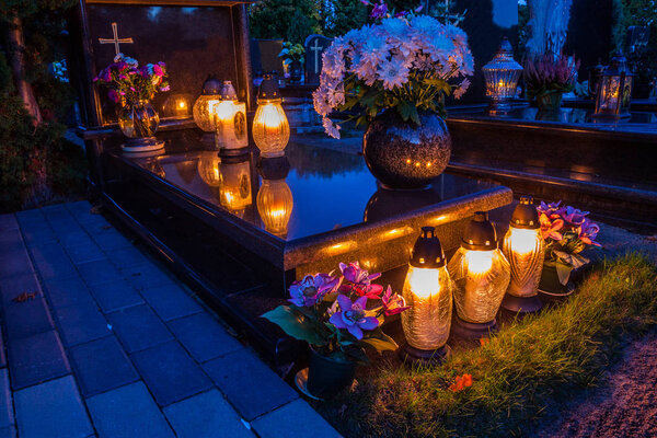 Candles Burning At a Cemetery 