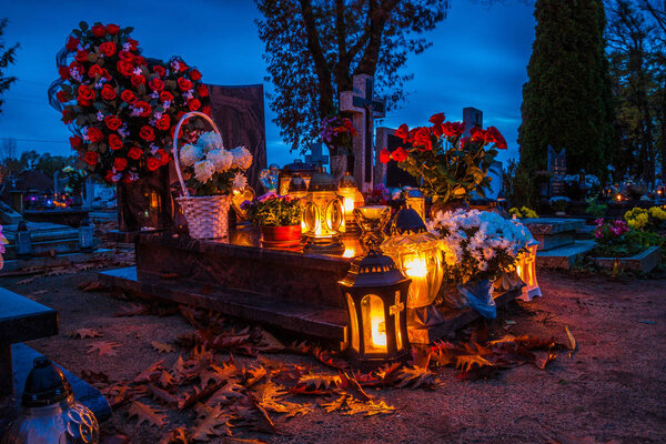 Colorful candles on the cemetery at All Saints Day