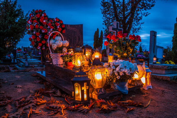 Colorful candles on the cemetery at All Saints Day