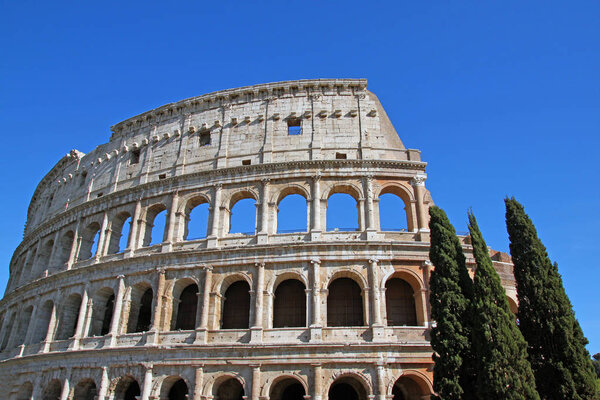 View of Colosseum against blue sky in Rome, Italy