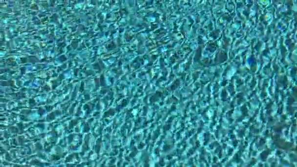 Blue swimming pool rippled water detail — Stock Video