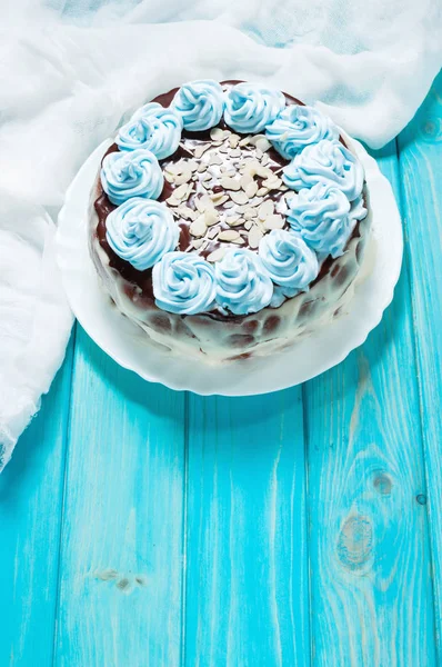 Cake with blue cream on wood background. — Stock Photo, Image