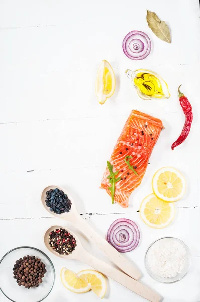 Delicious portion of fresh salmon fillet with aromatic herbs, spices and vegetables - healthy food, diet or cooking concept. — Stock Photo, Image