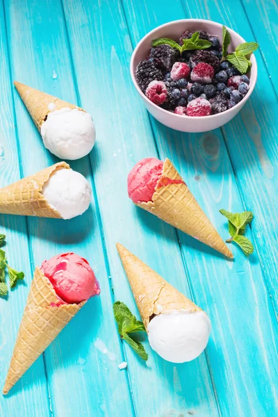 Waffle cones for ice cream on blue wooden table. Summer — Stock Photo, Image