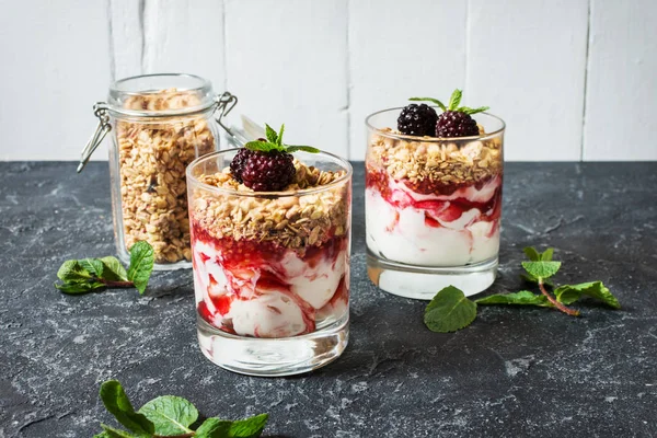 Healthy Layered Dessert Yogurt Granola Jam Blackberry Glass Stone Background — Stock Photo, Image