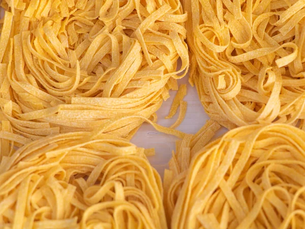 Dry noodles how to cook concept. Dry noodles close up background