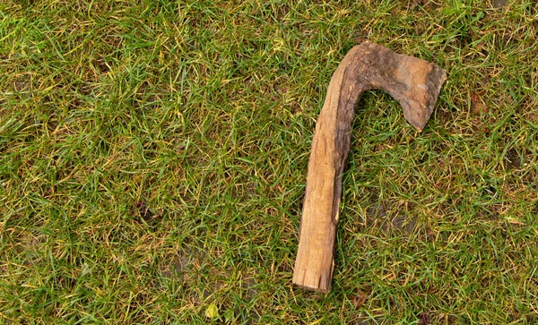 Piece of wood shaped like an axe