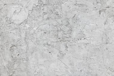 Duvarda çatlak bir sıva var. Somut arkaplan.