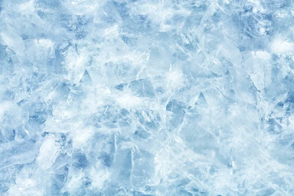 Cracked light blue ice. Frozen water in winter — 스톡 사진