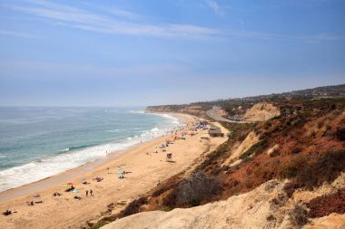 Blue sky over the farthest south end of Crystal Cove beach clipart
