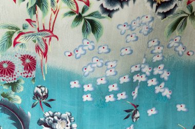 Aqua blue Asian çiçekli kumaş baskı arkaplan dokusu.