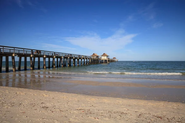 Naples, Florida, USA - May 9, 2020: Empty Naples Pier after it was closed off due to the Covid 19 virus outbreak in Naples, Florida