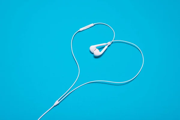 White headphones in the form of a heart — Stock Photo, Image