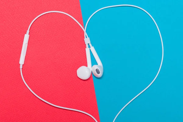 White headphones in the form of a heart — Stock Photo, Image