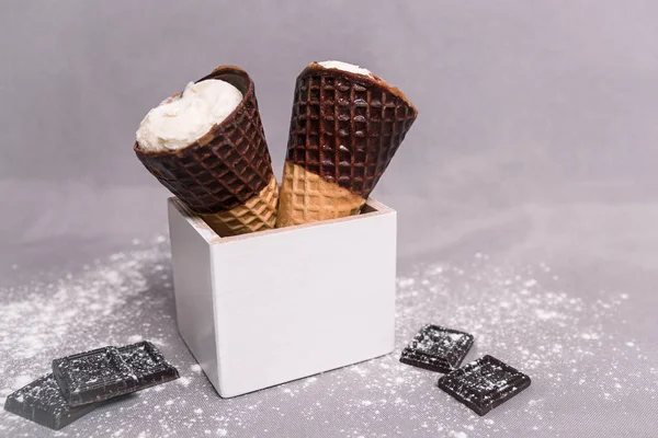 Ice cream in a horn with chocolate — Stock Photo, Image