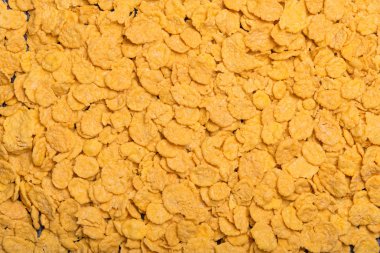 Pul arka plan üzerinde dağınık. Mısır gevreği. Metin için arka plan. Yazıt için arka plan. Arka plan.