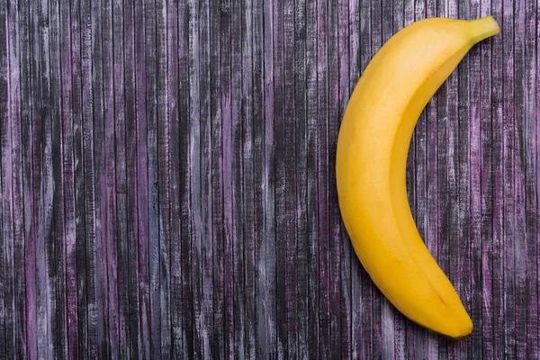 Banana on a wooden background. Fruit on the background. Place for text. Mock up. — Stock Photo, Image