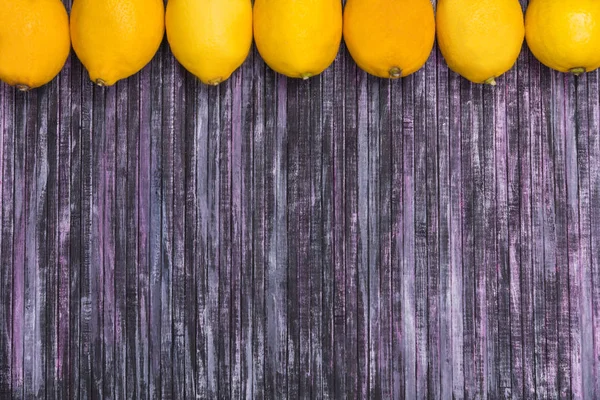 Lemons on a wooden background. Citrus fruits. Fruit. Place for the inscription. — Stock Photo, Image