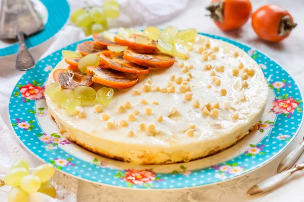 Curd pudding with white chocolate, decorated with persimmon and grapes. cottage cheese casserole with fruit — Stock Photo, Image