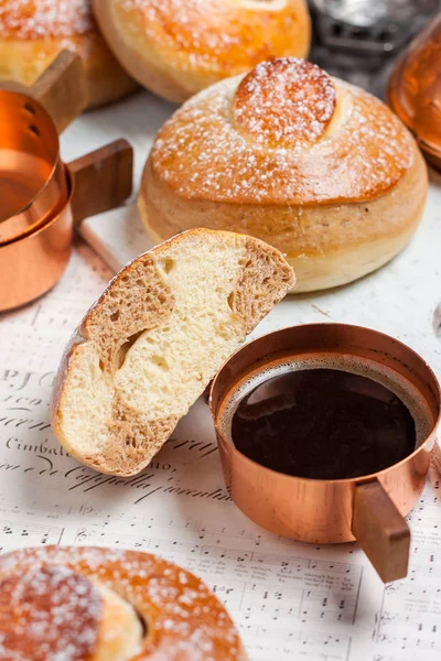 Buns with chocolate, cocoa and coffee. Breakfast. Copper Cezve with black coffee — Stock Photo, Image