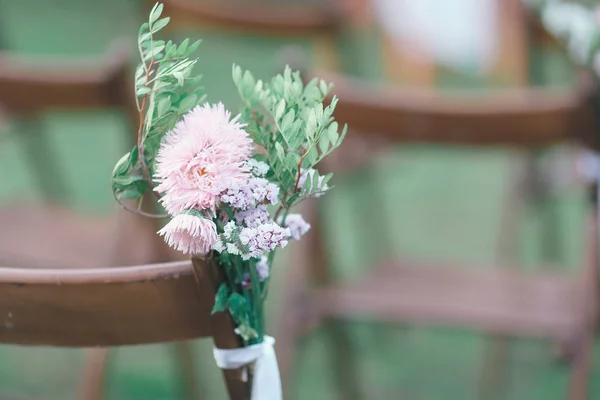 Rustic wedding photo zone. Hand made wedding decorations includes Photo Booth, wooden barrels and boxes, lanterns, suitcases and white flowers