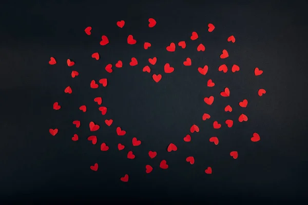 Love red hearts on dark background