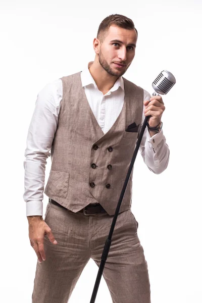 Portrait of young man in suit singing with the microphone — Stock Photo, Image