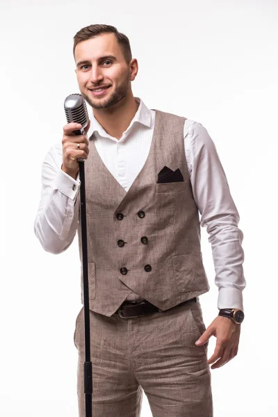 Portrait of young man in suit singing with the microphone — Stock Photo, Image