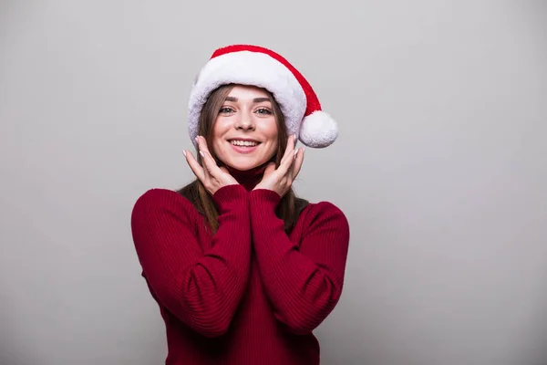 Різдвяна дівчина з різним жестом і капелюхом Санти — стокове фото