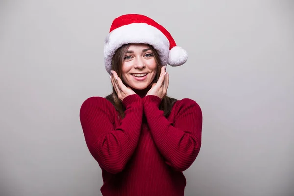 Christmas flicka med olika gest och santa hatt — Stockfoto