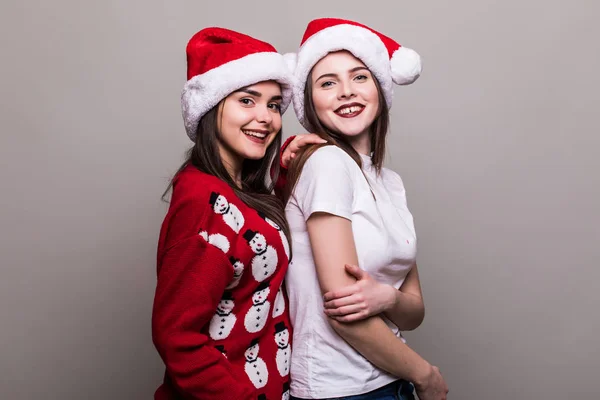 Two teenegers girls in santa hat — Stock Photo, Image
