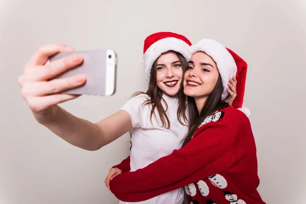 Two teenegers girls in santa hat — Stock Photo, Image