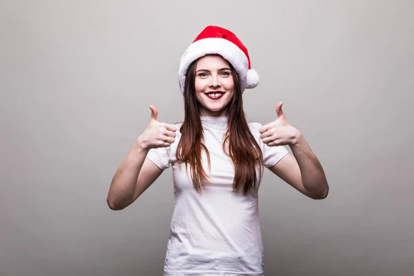 Жіноча модель носить капелюх Санта з жестом джакузі — стокове фото