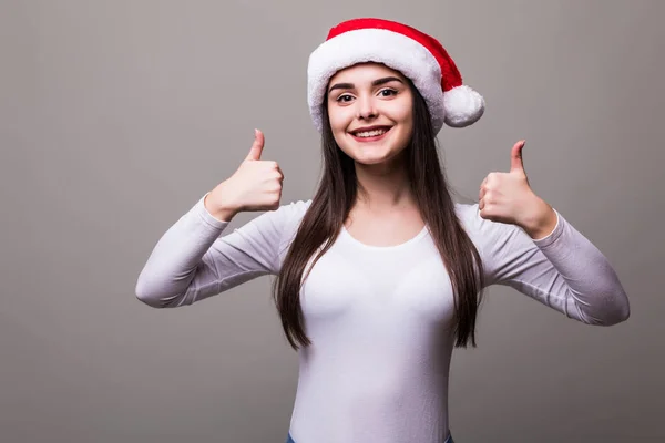 Жіноча модель дівчини носить капелюх Санта з жестом джакузі — стокове фото