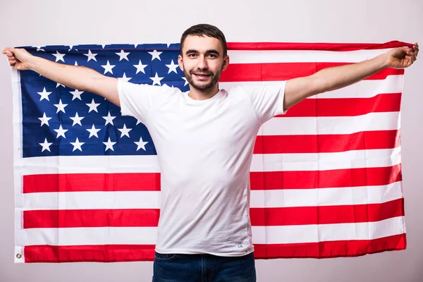 Jovem homem bonito com bandeira americana . — Fotografia de Stock