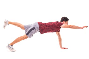 Kuş köpek Plank. Genç adam spor egzersiz yaparak.