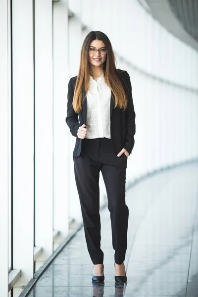 Full length portrait of happy business woman in office — Stock Photo, Image